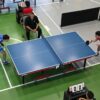 Ocho universidades buscan el pase a semifinales del tenis de mesa de la LAI Estudiantes-atletas universitarios disputan un partido de tenis de mesa durante una competencia deportiva.